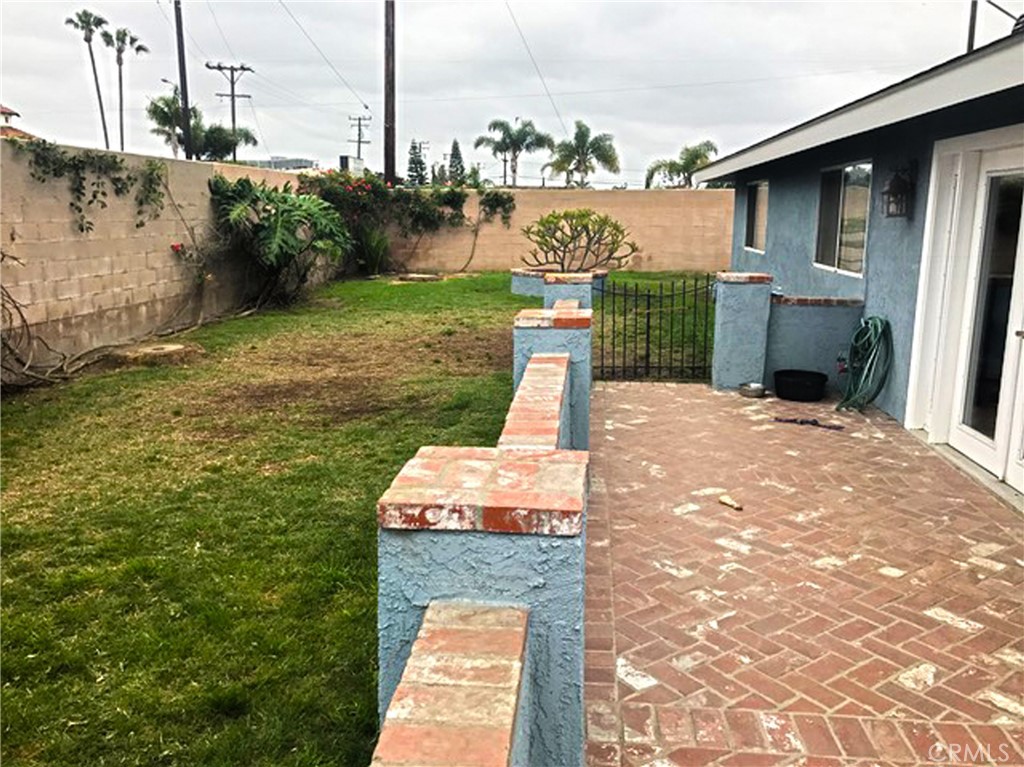 20011 Shorewood Circle Huntington Beach, CA 92646 - Photo 14 of 15 a front view of a house with garden