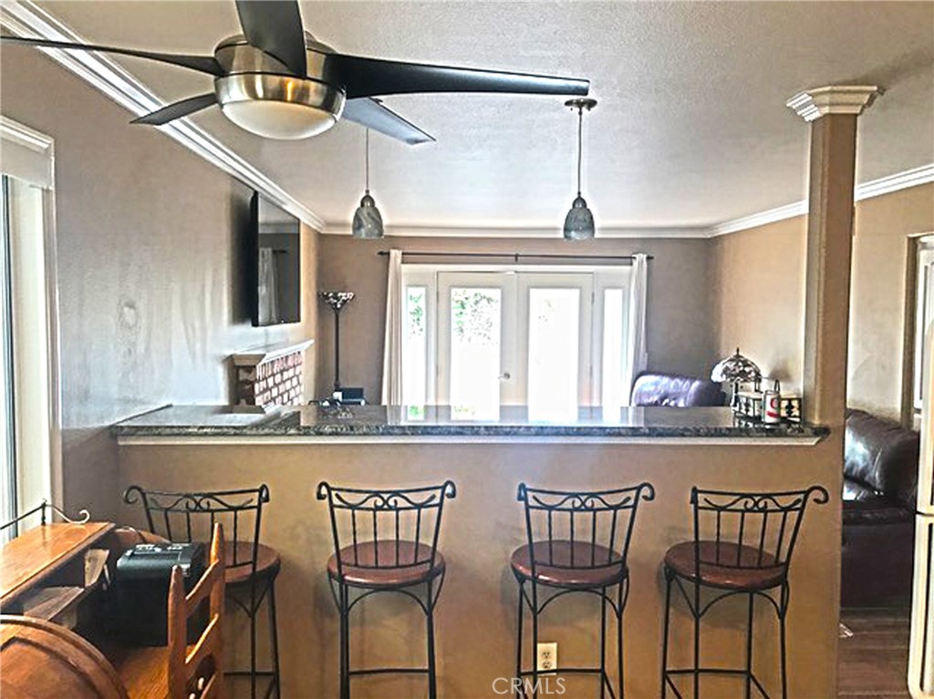 20011 Shorewood Circle Huntington Beach, CA 92646 - Photo 5 of 15 a dining table chair next to a window