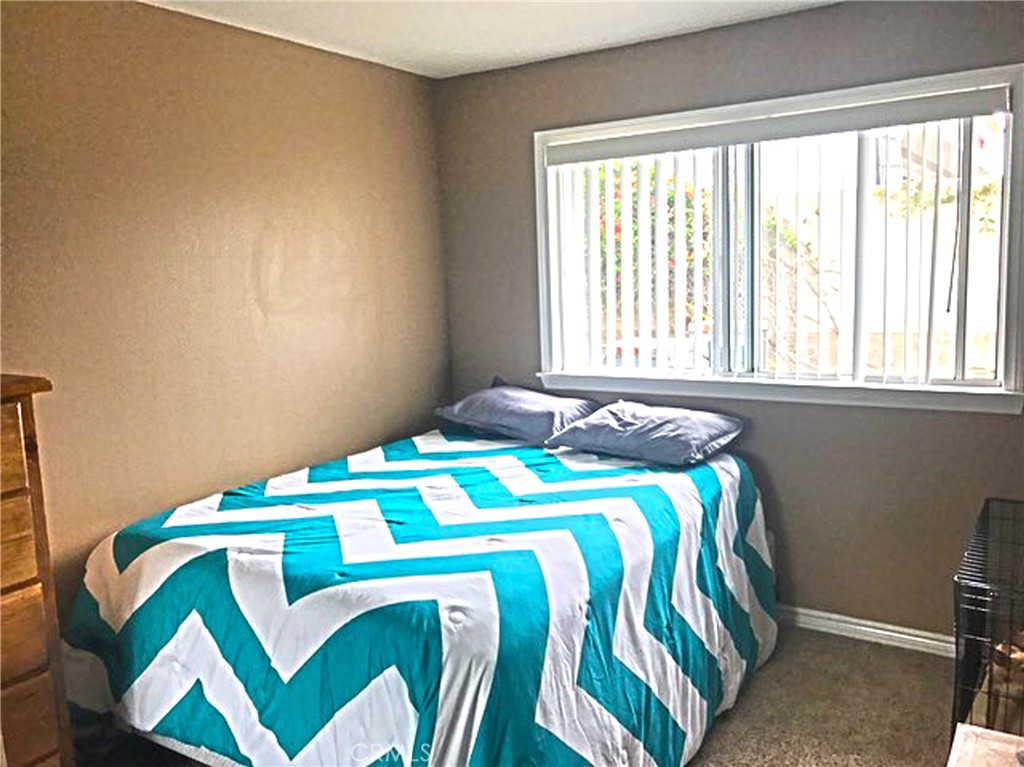 20011 Shorewood Circle Huntington Beach, CA 92646 - Photo 8 of 15 a bedroom with a bed and a window