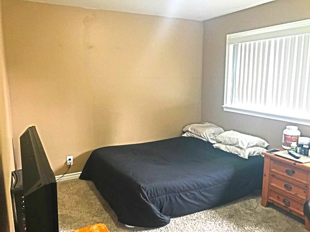 20011 Shorewood Circle Huntington Beach, CA 92646 - Photo 10 of 15 a bedroom with a bed next to a window