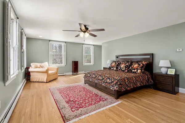 a bedroom with bed and window