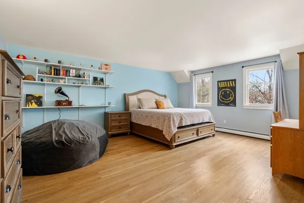 a bedroom with a bed and window