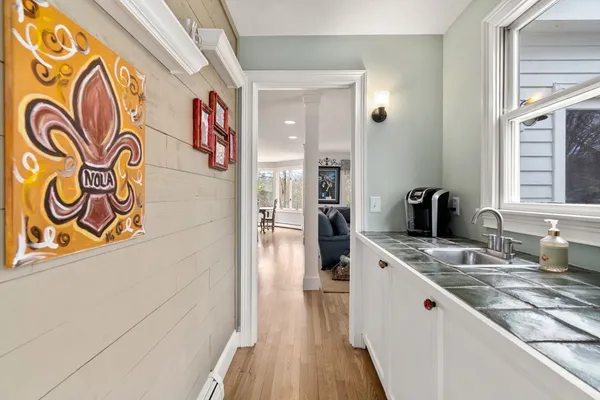 a kitchen with a sink and a refrigerator