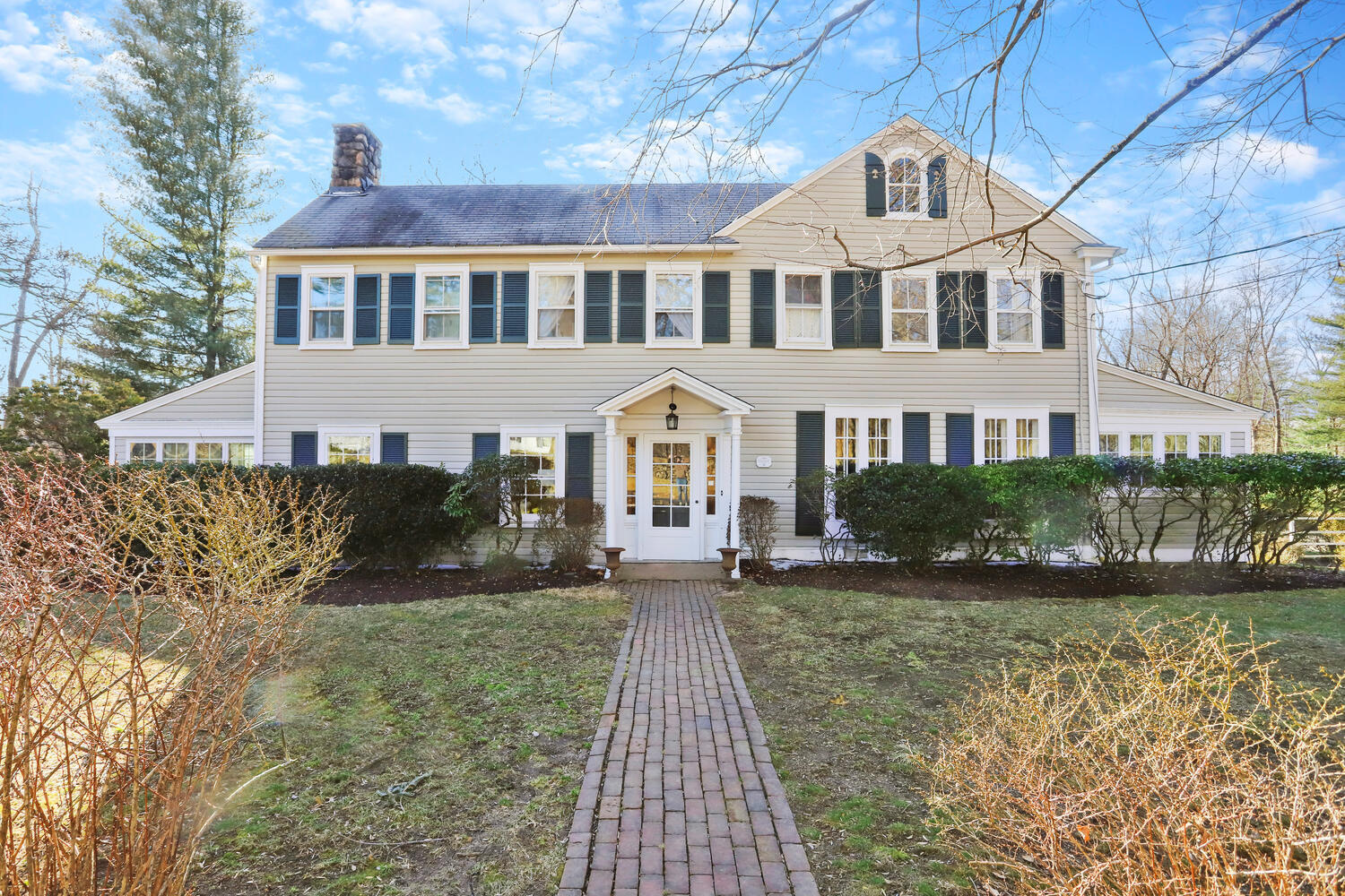 829 Hollow Tree Ridge Road Darien, CT 06820 - Photo 1 of 40 a front view of a house with garden