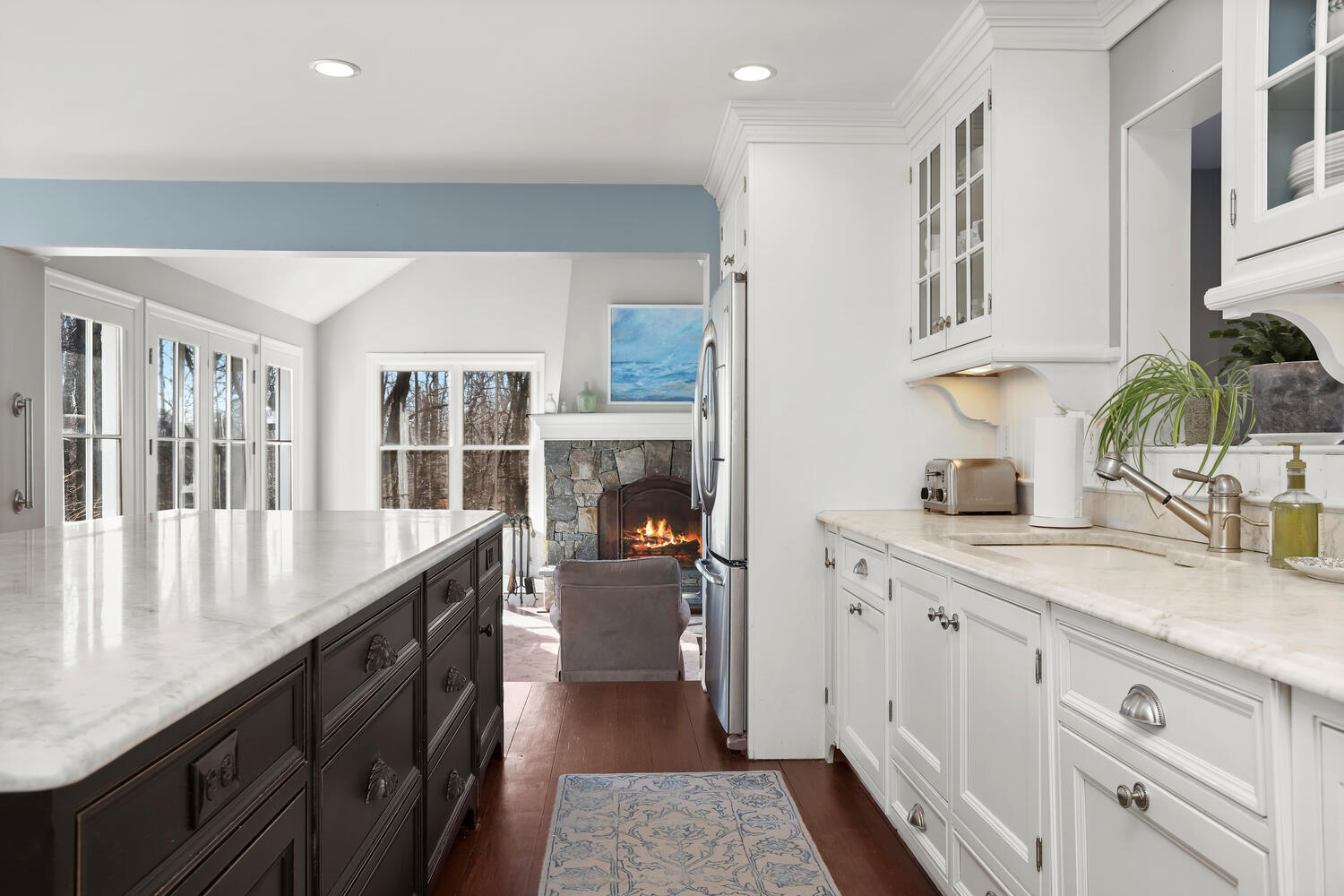 829 Hollow Tree Ridge Road Darien, CT 06820 - Photo 12 of 40 a kitchen with a sink stove and cabinets