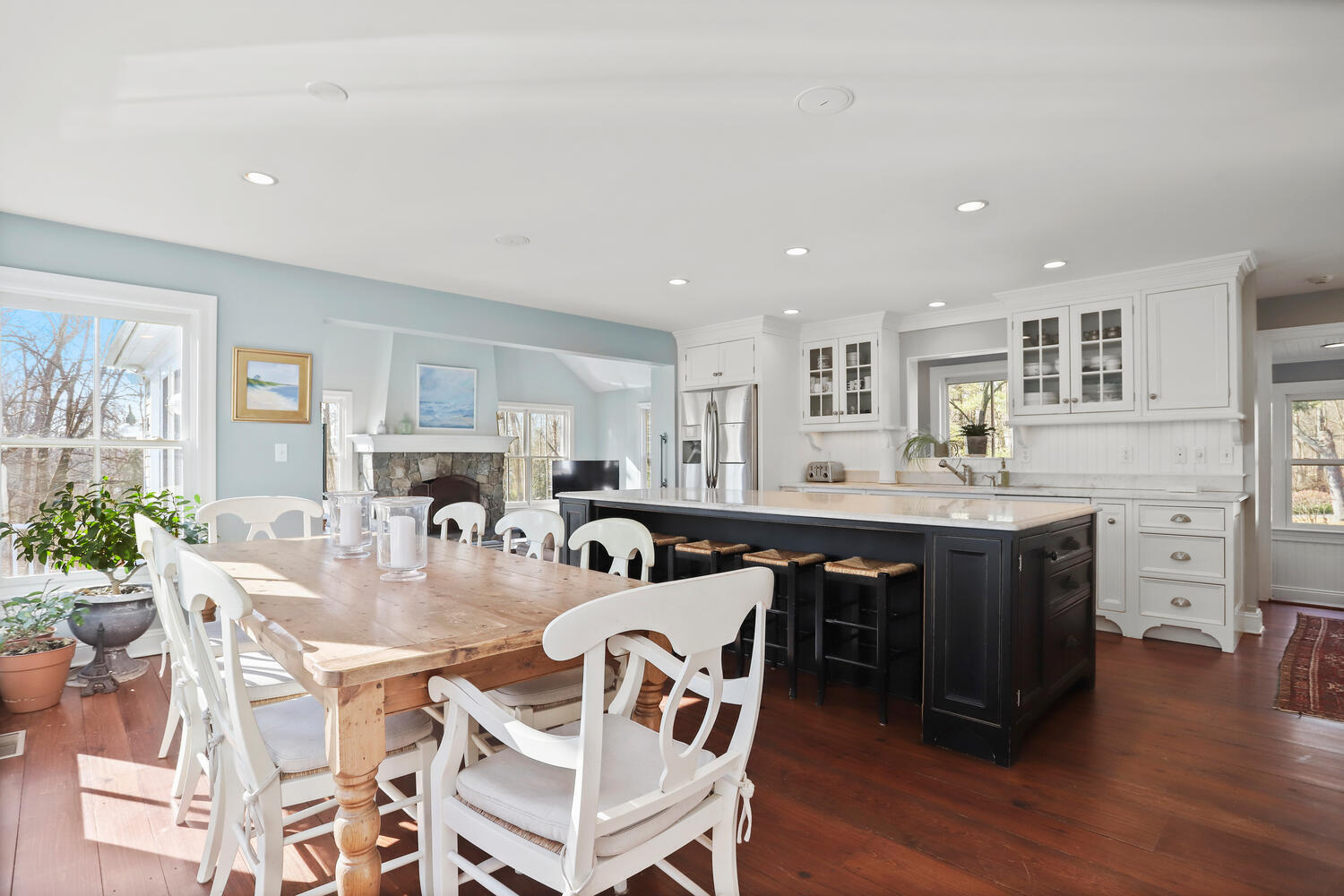 829 Hollow Tree Ridge Road Darien, CT 06820 - Photo 13 of 40 a view of a dining room with furniture and wooden floor