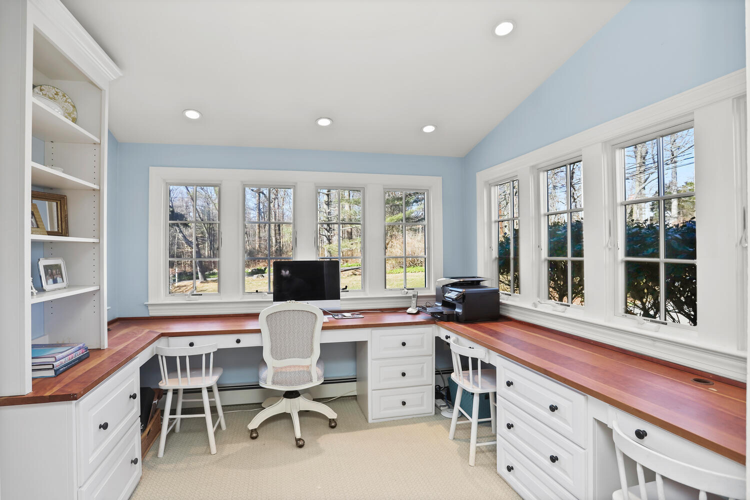 829 Hollow Tree Ridge Road Darien, CT 06820 - Photo 20 of 40 a view of a dining room with furniture a chandelier and window