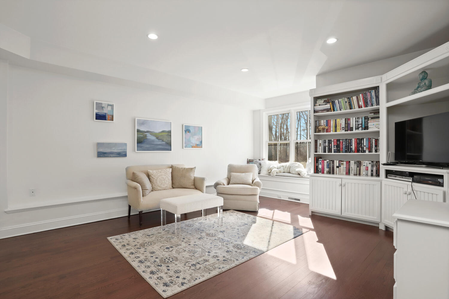829 Hollow Tree Ridge Road Darien, CT 06820 - Photo 30 of 40 a living room with furniture and a flat screen tv