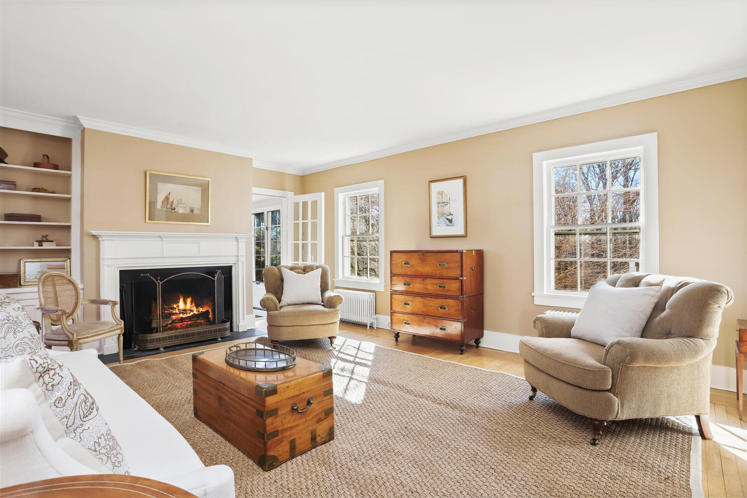 829 Hollow Tree Ridge Road Darien, CT 06820 - Photo 4 of 40 a living room with furniture and a fireplace
