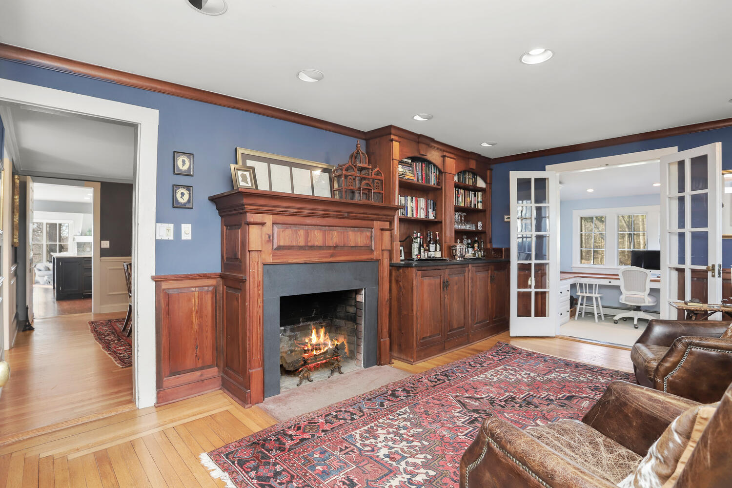 829 Hollow Tree Ridge Road Darien, CT 06820 - Photo 6 of 40 a living room with furniture and a fireplace