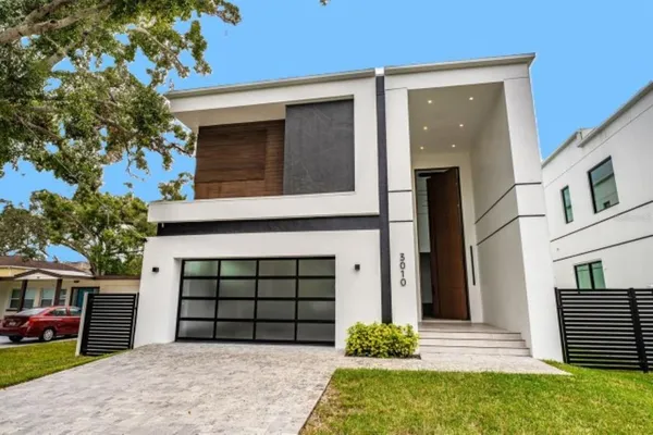 front view of a house with a yard