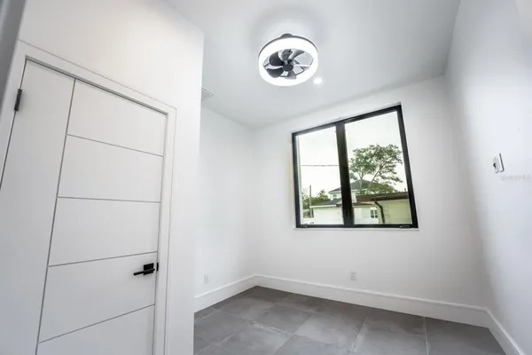 a bathroom with a sink a toilet a mirror and shower