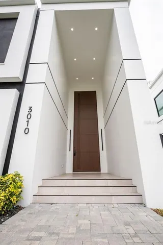 a view of an empty room with stairs