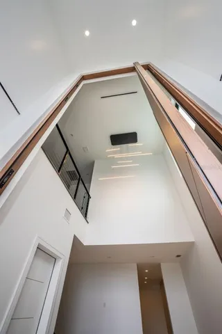a view of a kitchen with a sink and a large window