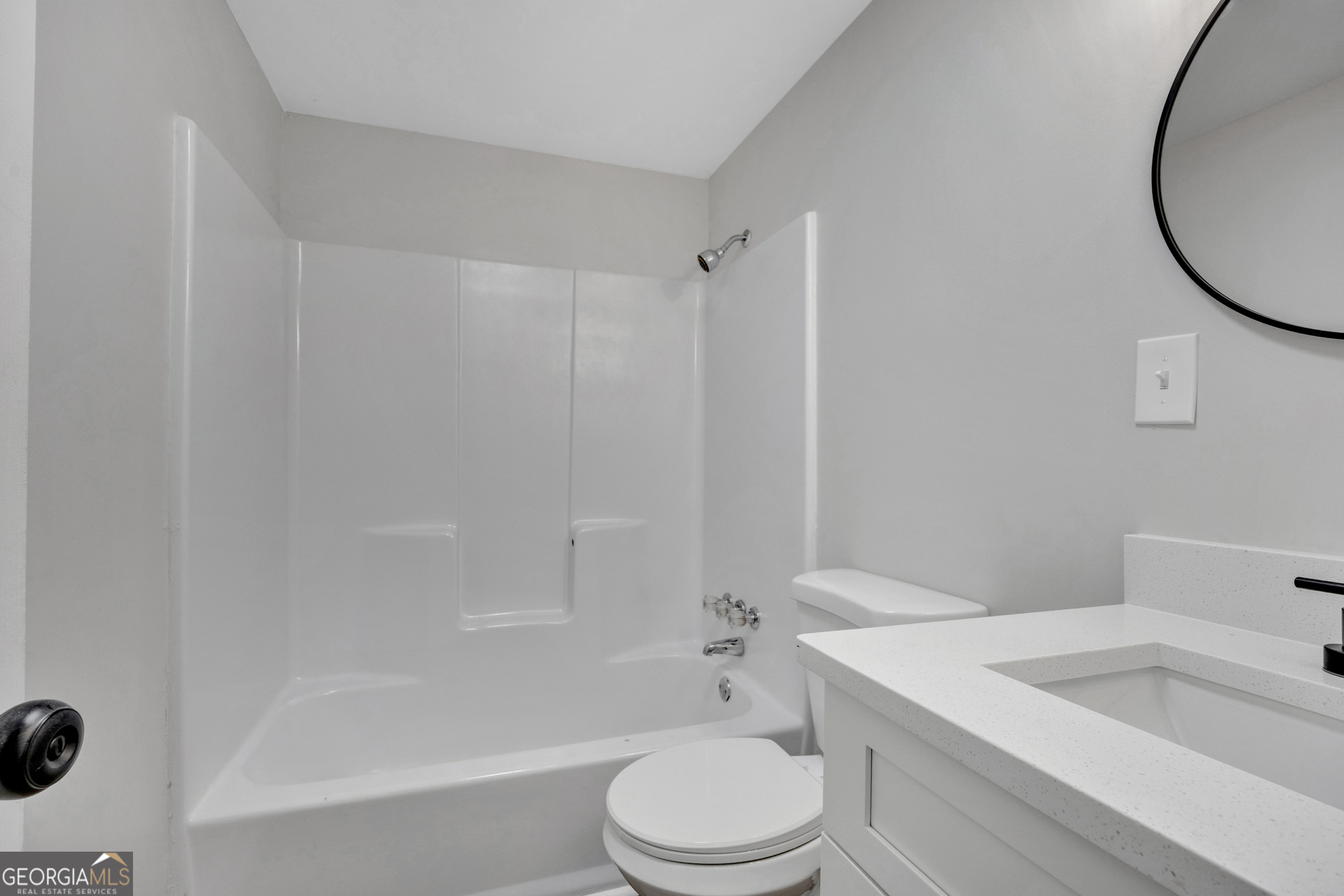 455 Cindy Street Jackson, GA 30233 - Photo 19 of 25 a bathroom with a sink a toilet and a bathtub