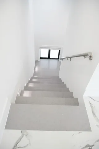 a view of a room with a ceiling fan