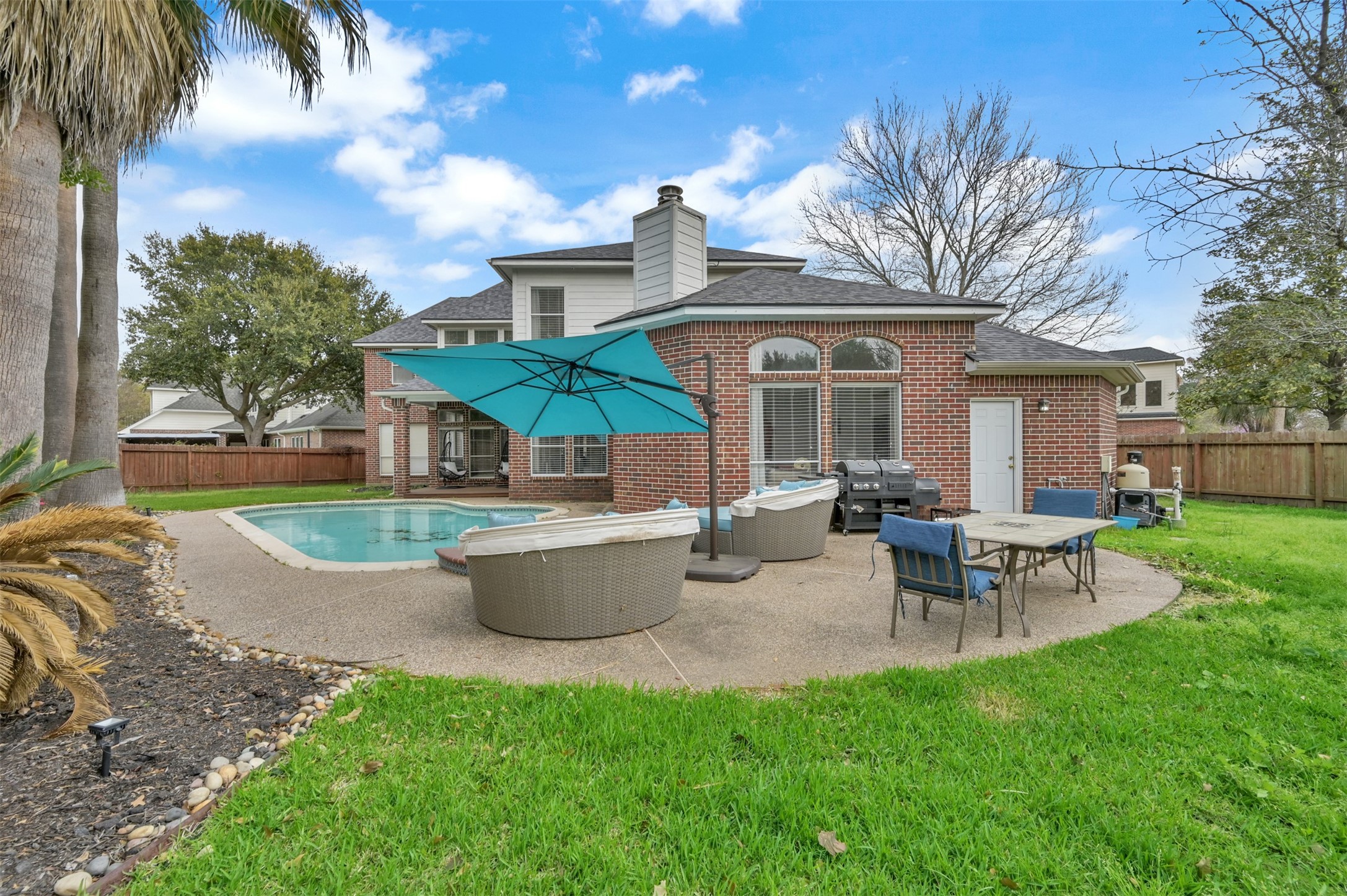 9706 Chipstead Court Spring, TX 77379 - Photo 42 of 44 Enjoy the comfy chairs, outdoor dining, and serene vibes of this home's exterior.
