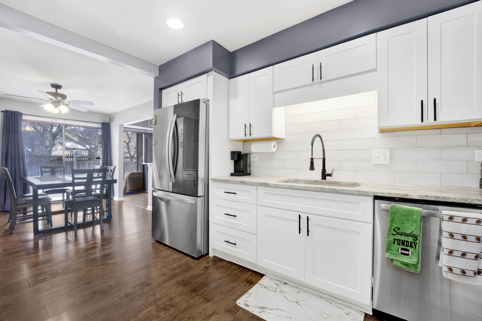 1495 South County Farm Road, Unit 12 Wheaton, IL 60189 - Photo 12 of 22 a kitchen with stainless steel appliances a refrigerator sink and microwave