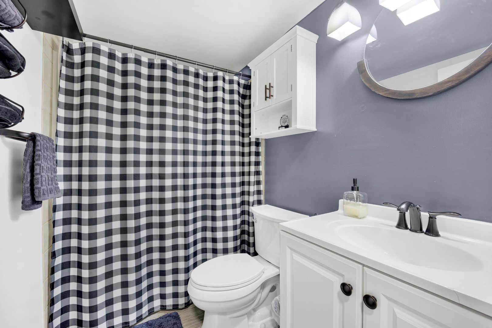 1495 South County Farm Road, Unit 12 Wheaton, IL 60189 - Photo 16 of 22 a bathroom with a sink and a mirror