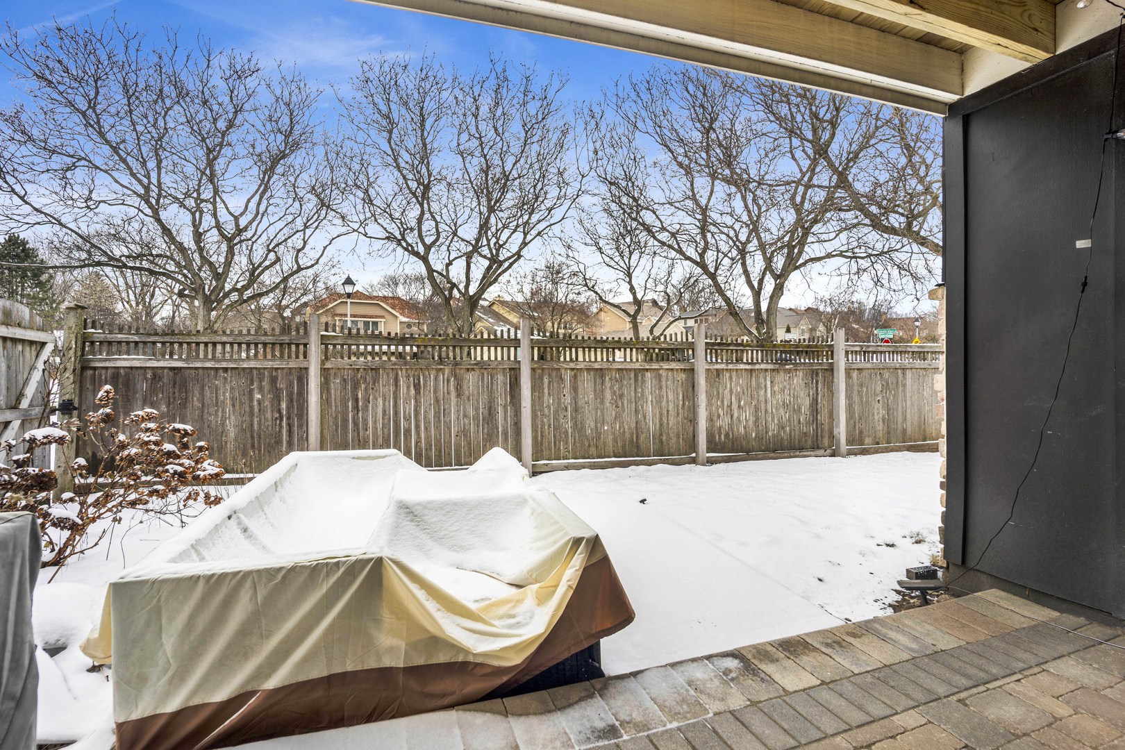 1495 South County Farm Road, Unit 12 Wheaton, IL 60189 - Photo 18 of 22 a view of backyard with wooden fence and large trees