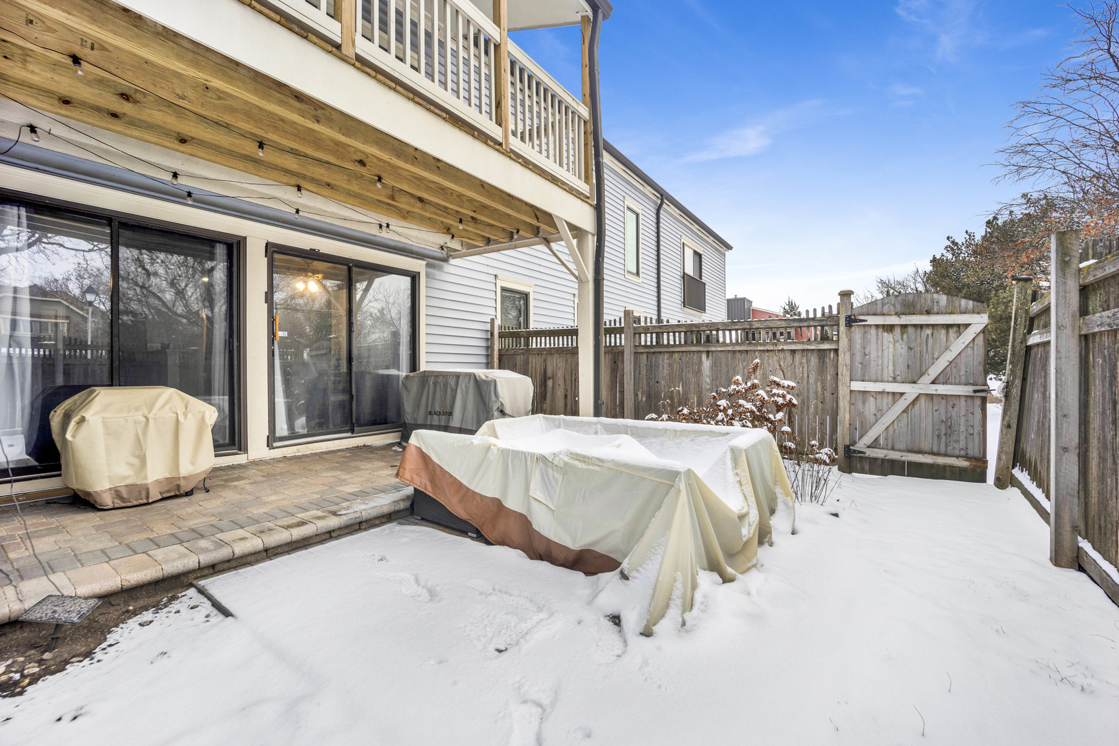 1495 South County Farm Road, Unit 12 Wheaton, IL 60189 - Photo 19 of 22 a view of a white bed and a roof deck