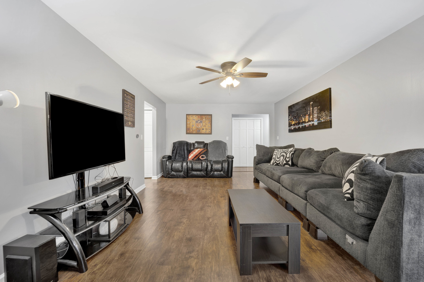 1495 South County Farm Road, Unit 12 Wheaton, IL 60189 - Photo 5 of 22 a living room with furniture and a flat screen tv