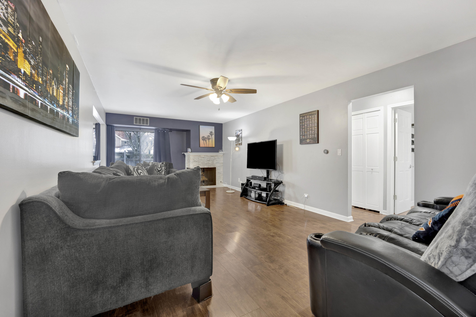 1495 South County Farm Road, Unit 12 Wheaton, IL 60189 - Photo 6 of 22 a living room with furniture and a flat screen tv