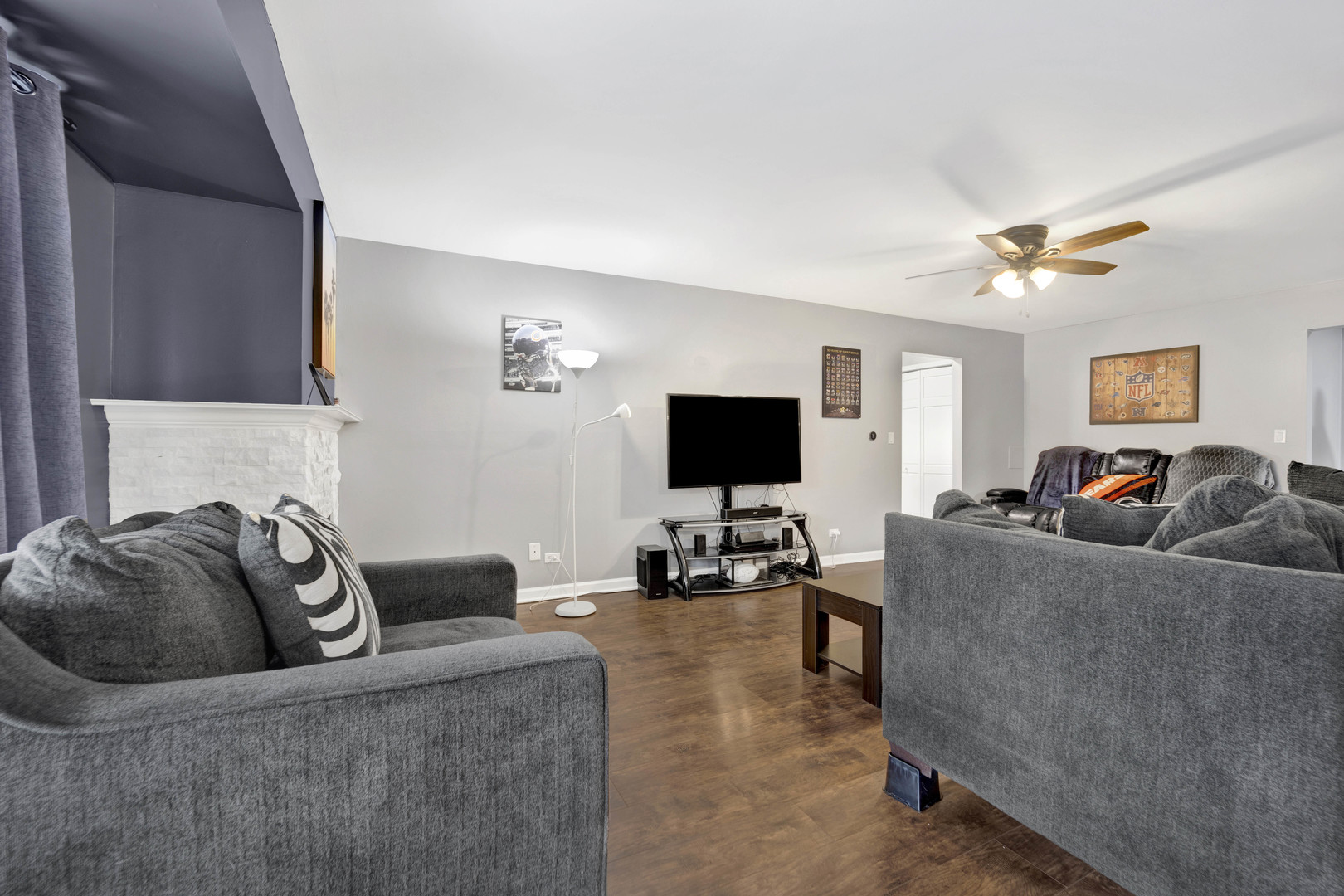 1495 South County Farm Road, Unit 12 Wheaton, IL 60189 - Photo 7 of 22 a living room with furniture and a flat screen tv