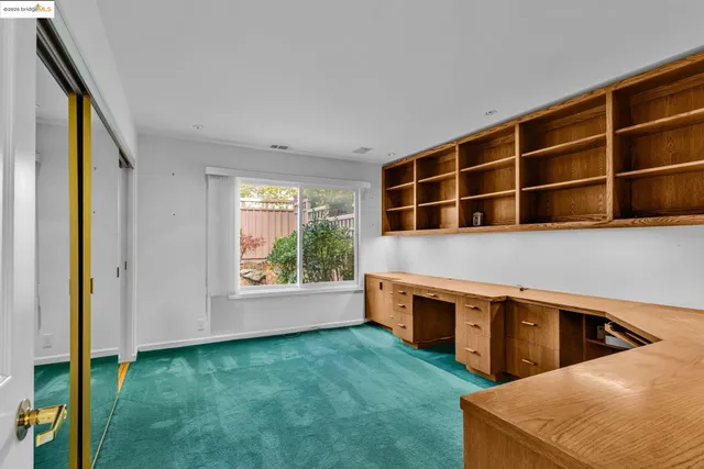 a view of a kitchen with furniture and window