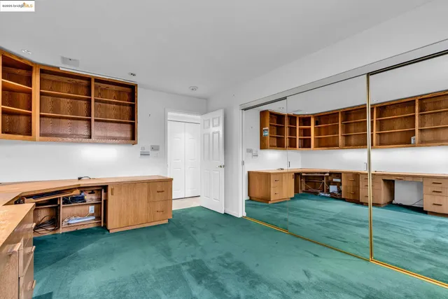 a kitchen with stainless steel appliances wooden cabinets a stove and a sink