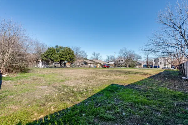 a swimming pool with wooden fence