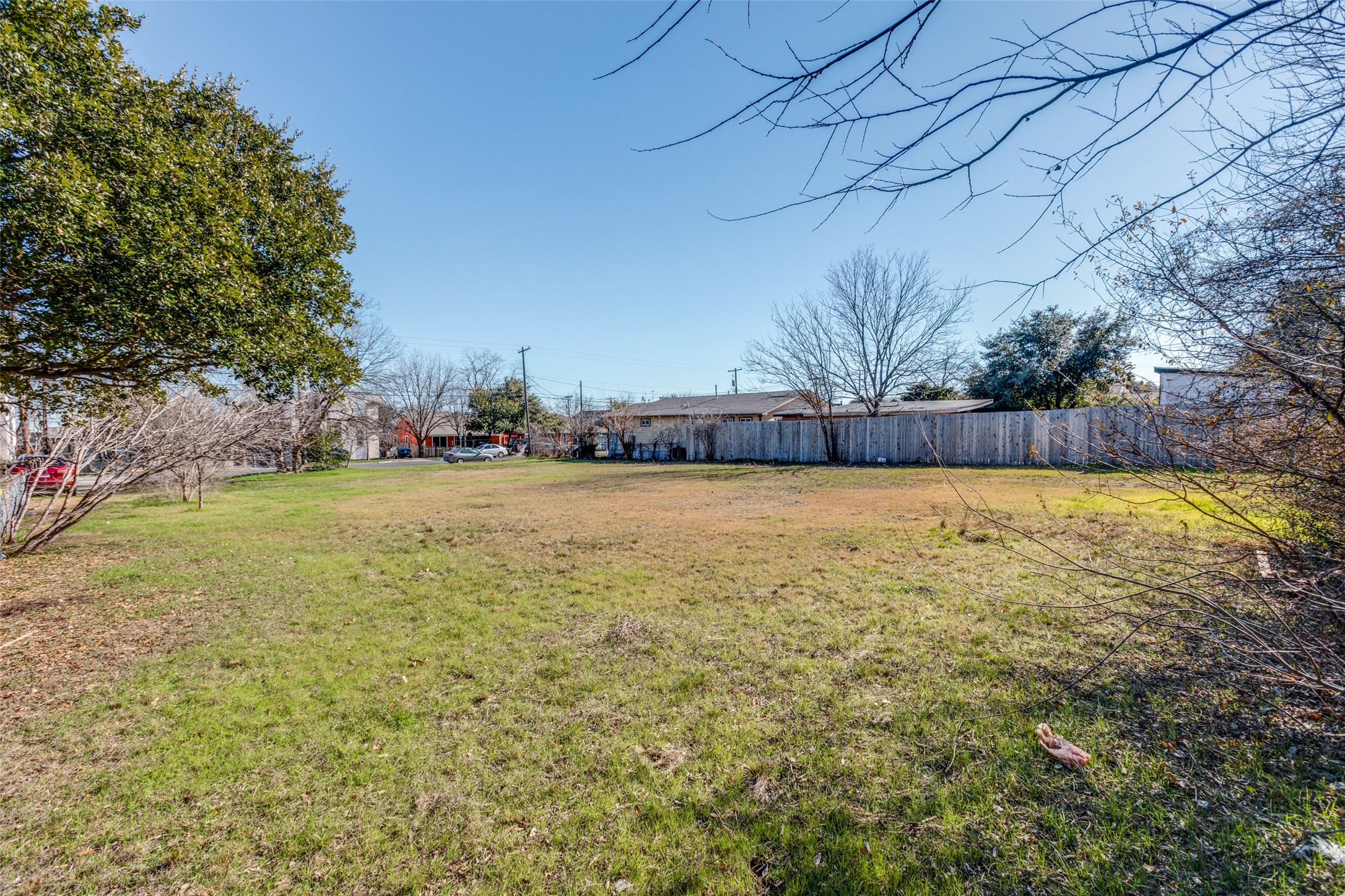 6908 Blessing Avenue Austin, TX 78752 - Photo 9 of 13 a view of a swimming pool and trees in the background