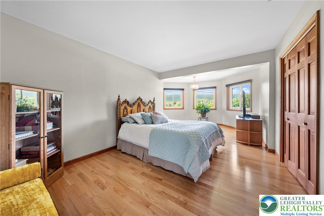 947 Tamenend Road Bath, PA 18014 - Photo 20 of 61 Hardwood floors and generous natural light create an inviting atmosphere in this bedroom.