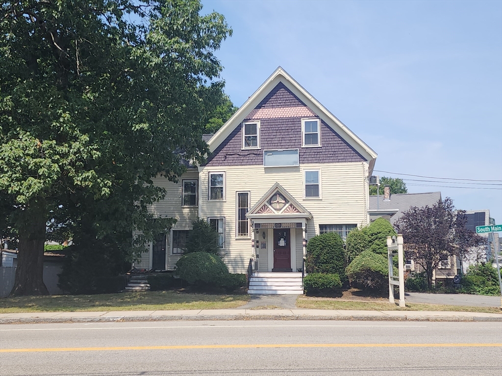 399 South Main Street Haverhill, MA 01835 - Photo 2 of 8 a front view of a house with a yard