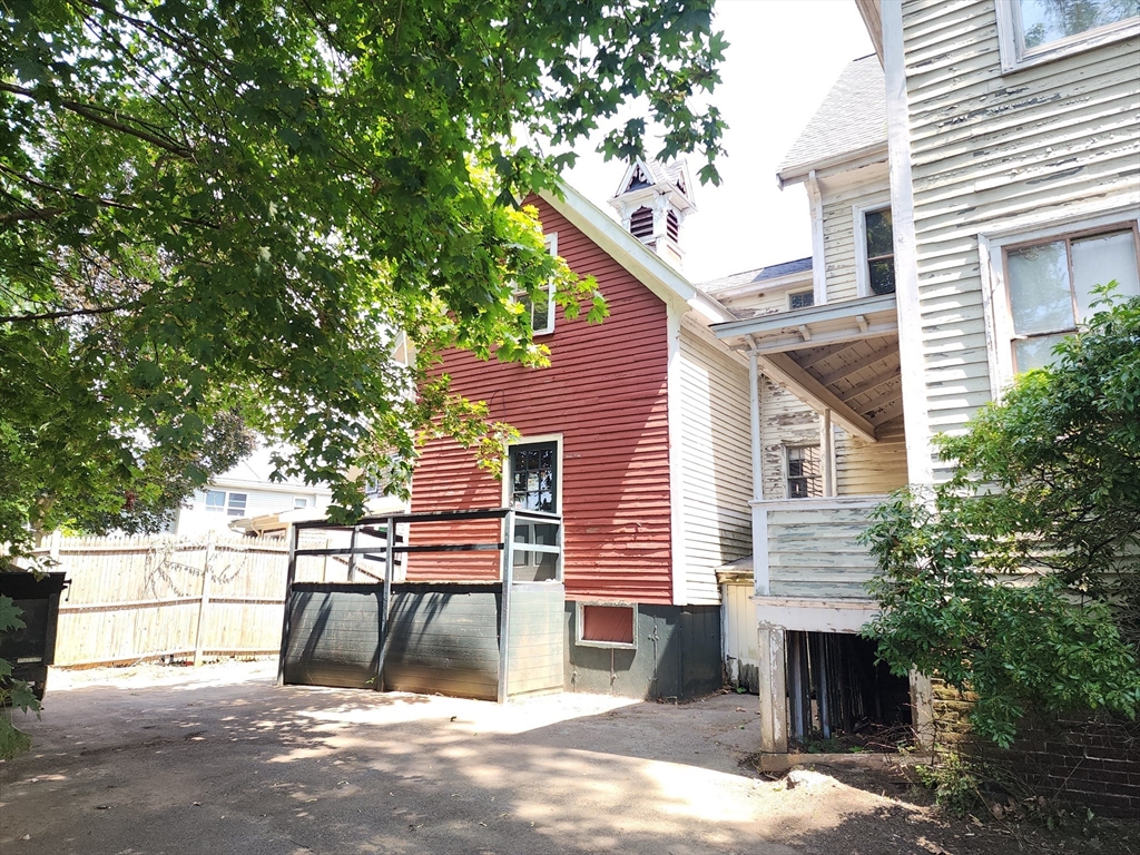399 South Main Street Haverhill, MA 01835 - Photo 5 of 8 a view of a patio with table and chairs and a large tree