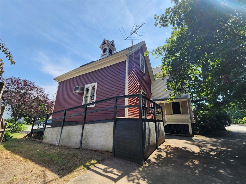 399 South Main Street Haverhill, MA 01835 - Photo 7 of 8 a view of a house with a yard