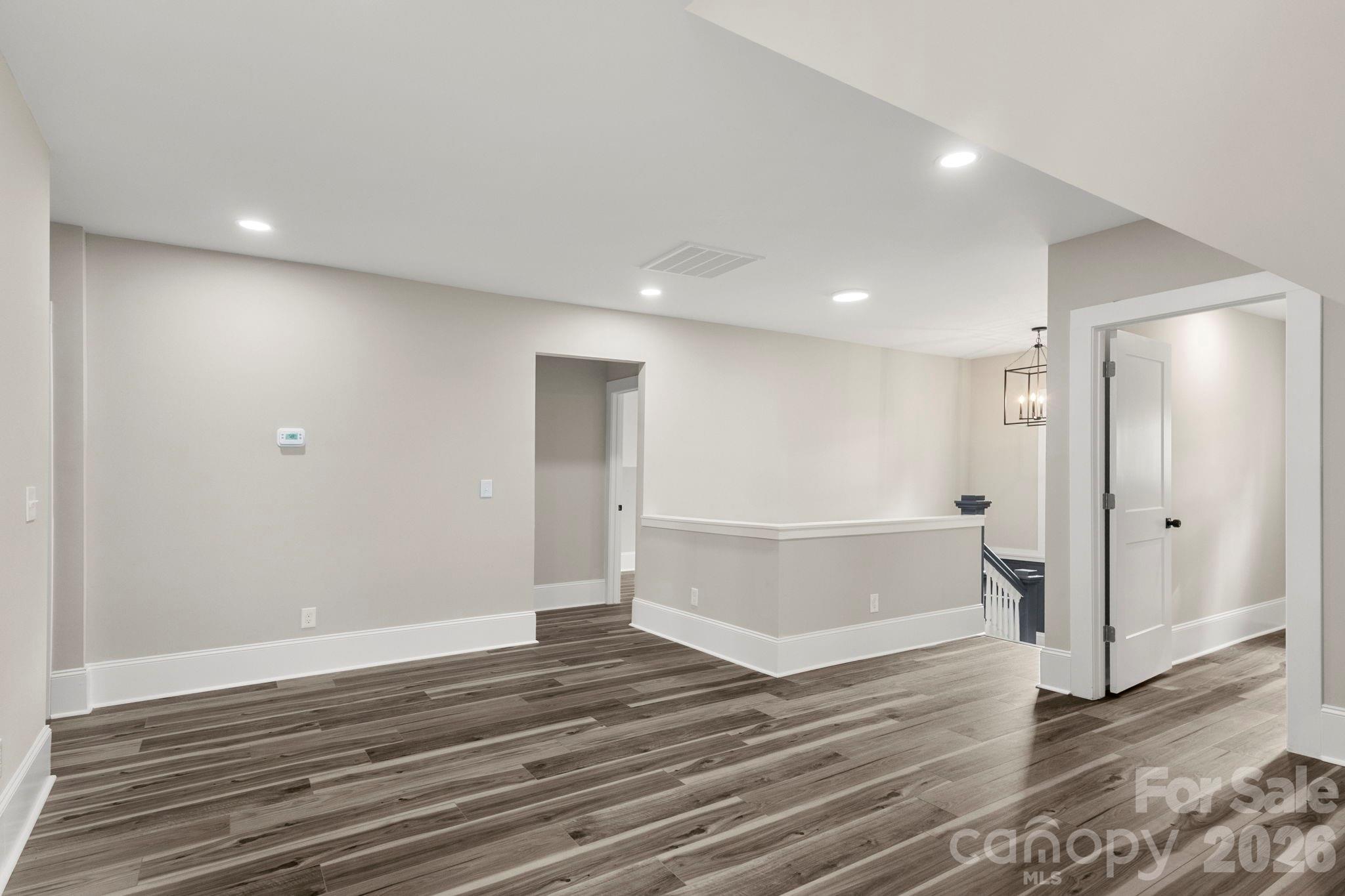 918 North New Hope Road Gastonia, NC 28054 - Photo 30 of 37 a view of a big room with wooden floor and white doors