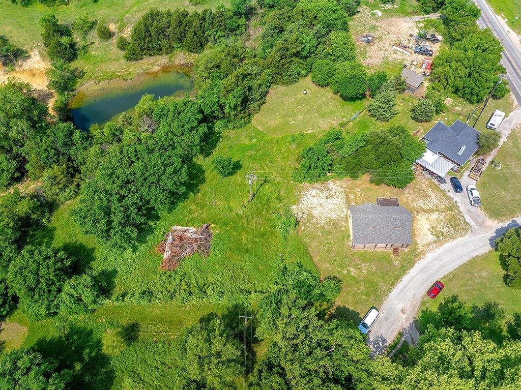 371 Spring Street Forestburg, TX 76239 - Photo 28 of 38 an aerial view of residential house with outdoor space and swimming pool