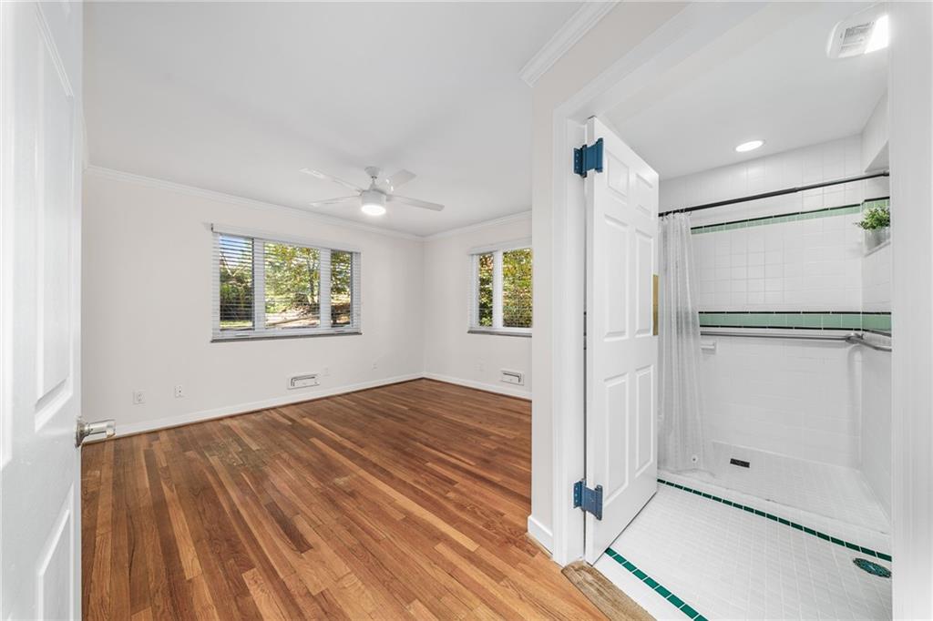 101 Buckingham Road Pittsburgh, PA 15215 - Photo 14 of 44 a view of empty room with wooden floor and fan