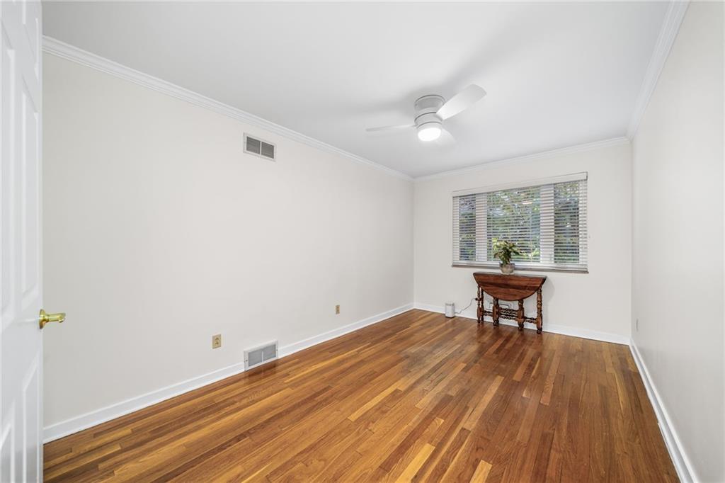 101 Buckingham Road Pittsburgh, PA 15215 - Photo 17 of 44 an empty room with wooden floor and windows