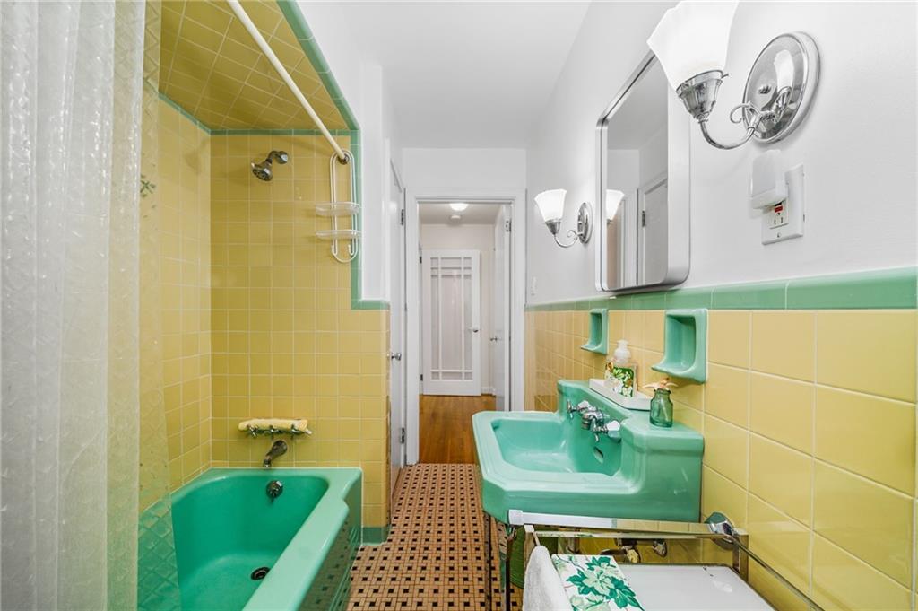 101 Buckingham Road Pittsburgh, PA 15215 - Photo 21 of 44 a bathroom with a sink and a mirror