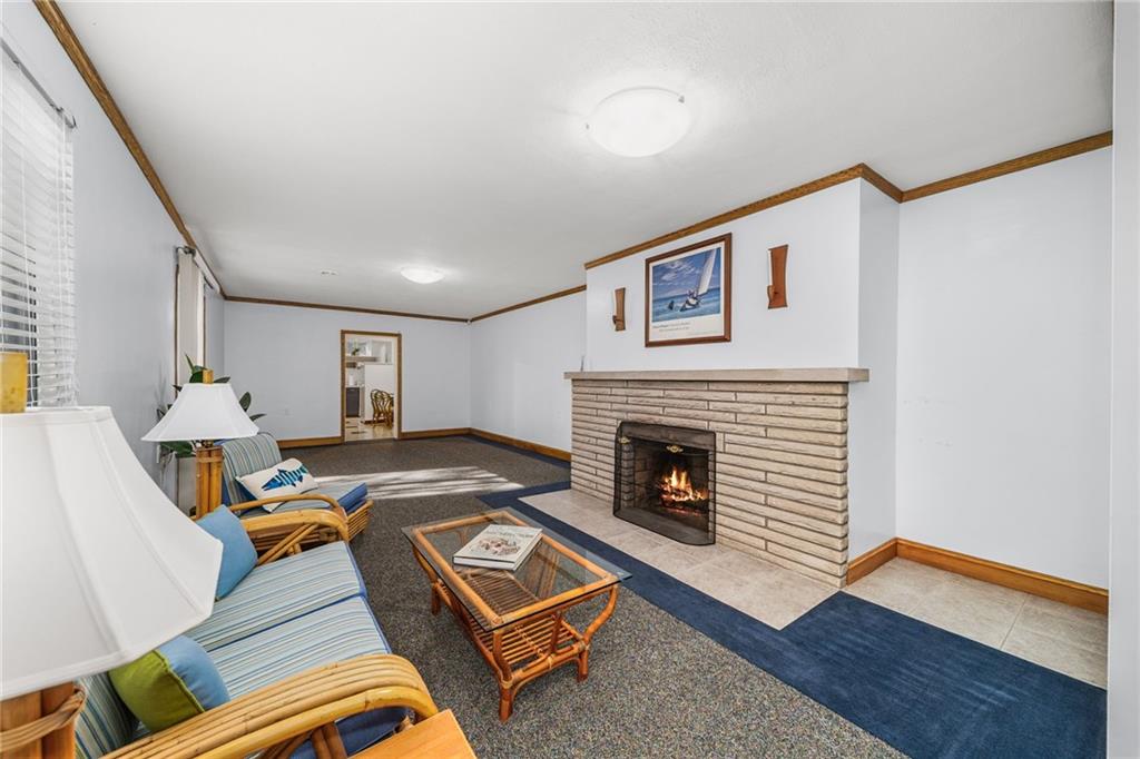 101 Buckingham Road Pittsburgh, PA 15215 - Photo 22 of 44 a living room with furniture and a fireplace