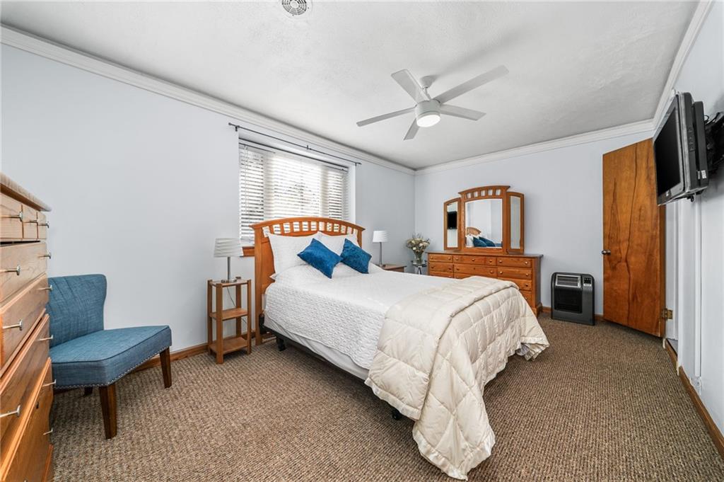 101 Buckingham Road Pittsburgh, PA 15215 - Photo 27 of 44 a bed room with a bed window and a chair