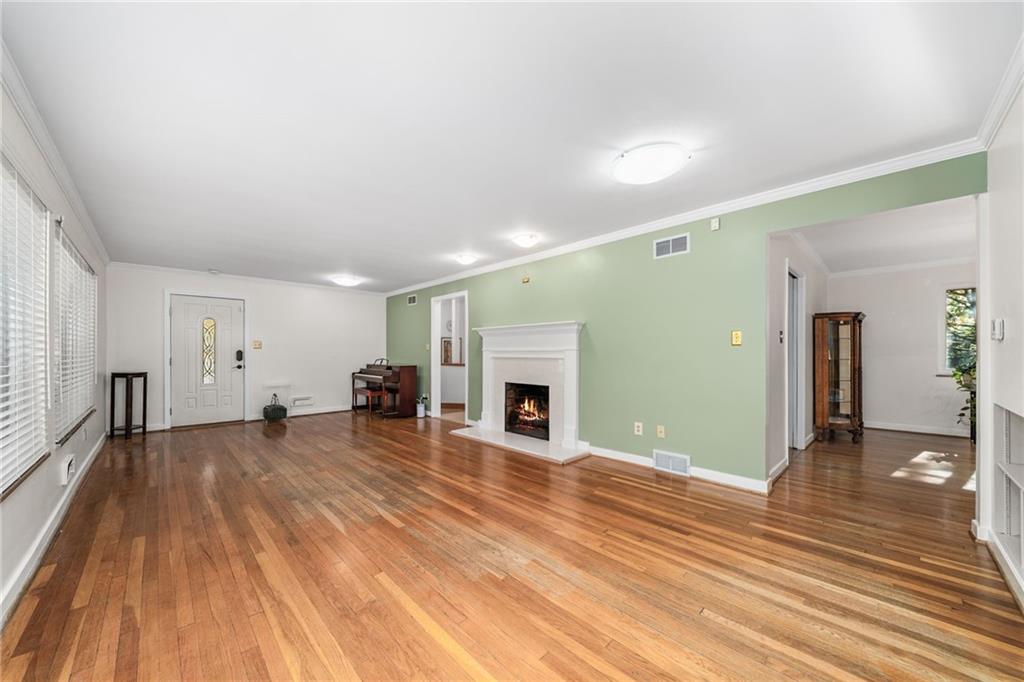 101 Buckingham Road Pittsburgh, PA 15215 - Photo 6 of 44 wooden floor fireplace and windows in a room