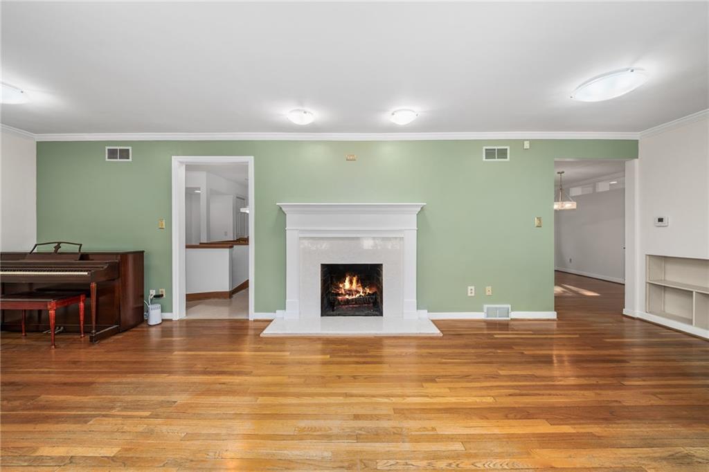 101 Buckingham Road Pittsburgh, PA 15215 - Photo 7 of 44 a living room with furniture and a fireplace