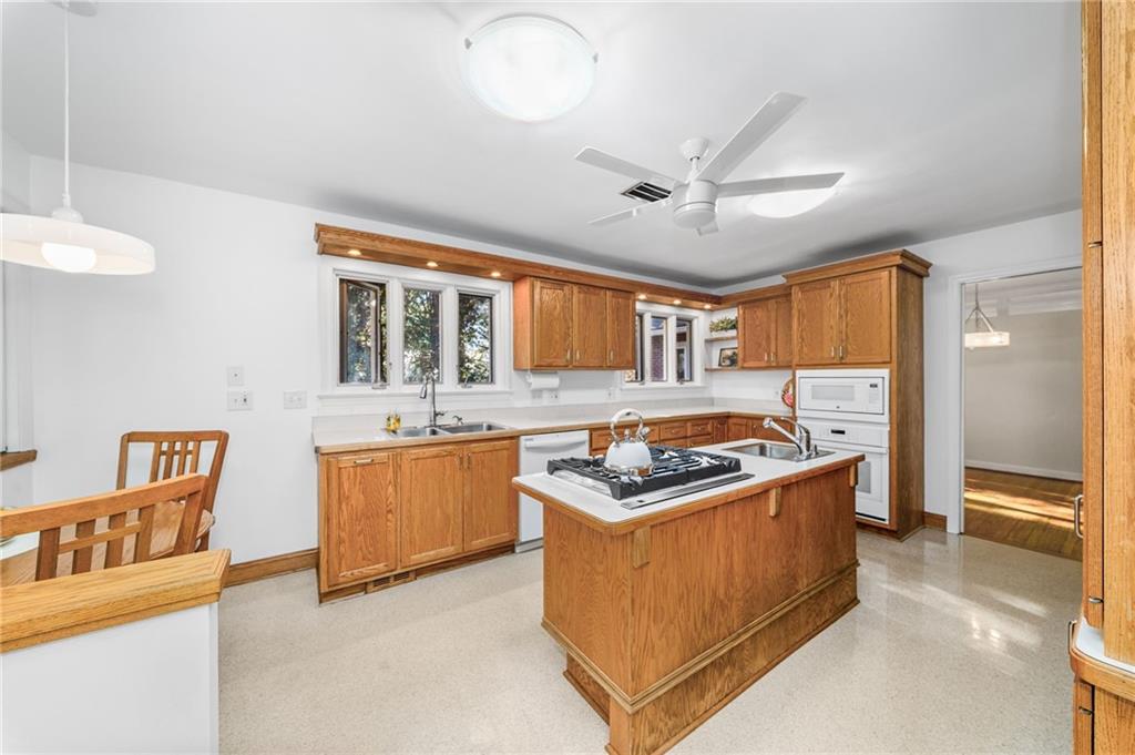 101 Buckingham Road Pittsburgh, PA 15215 - Photo 10 of 44 a kitchen with stainless steel appliances granite countertop a stove and a sink