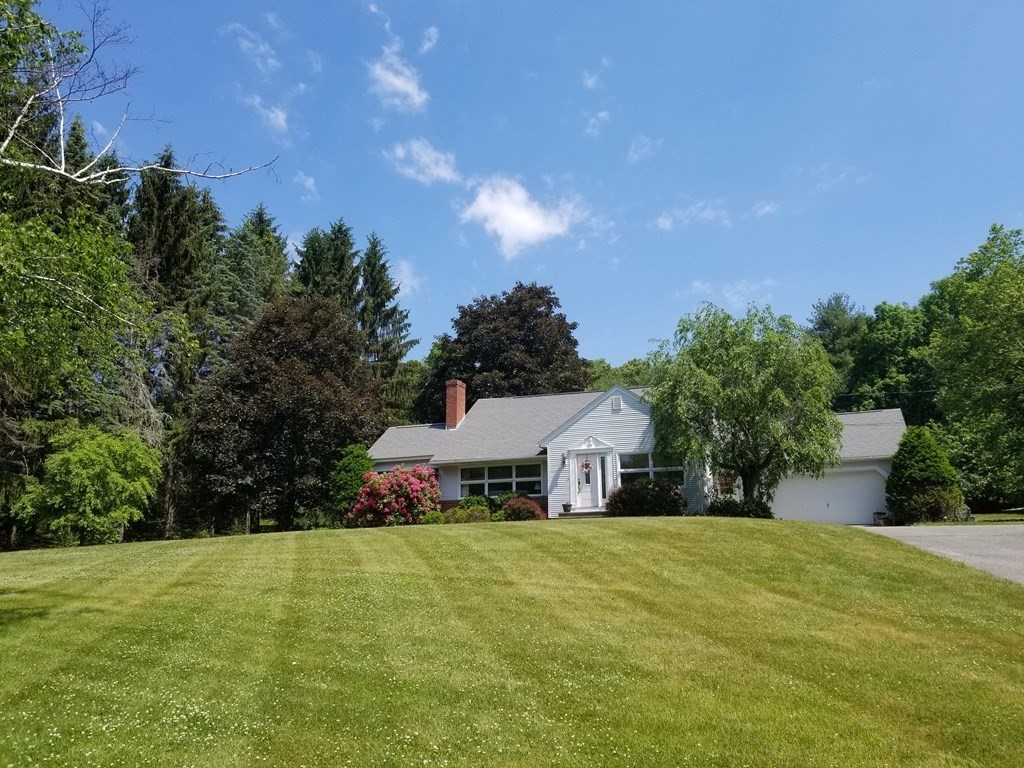 235 Belchertown Road Ware, MA 01082 - Photo 1 of 27 a front view of a house with a yard