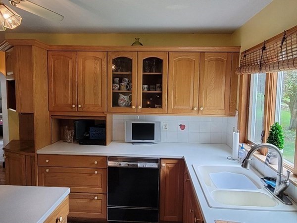 235 Belchertown Road Ware, MA 01082 - Photo 12 of 27 a kitchen with a sink and a refrigerator