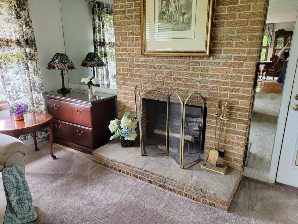 235 Belchertown Road Ware, MA 01082 - Photo 20 of 27 a living room with furniture and a fireplace