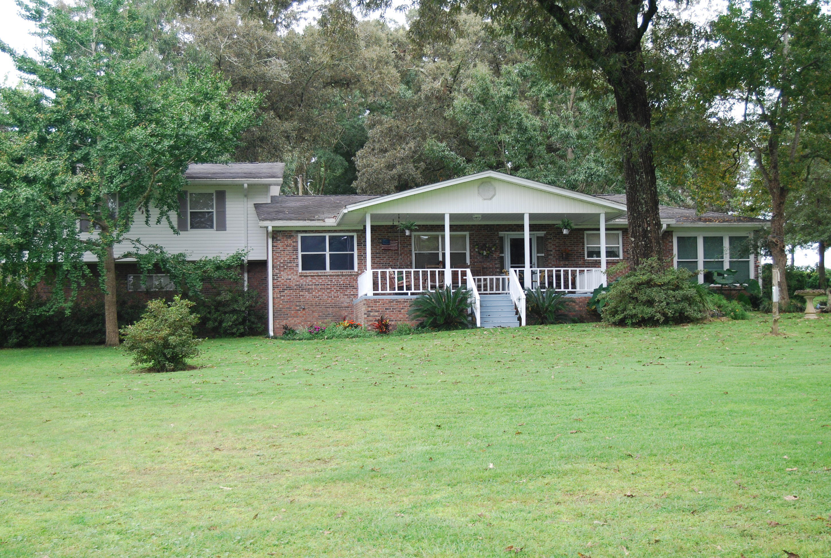 791 Dr Nelson Road DeFuniak Springs, FL 32433 - Photo 1 of 46 a front view of a house with a garden